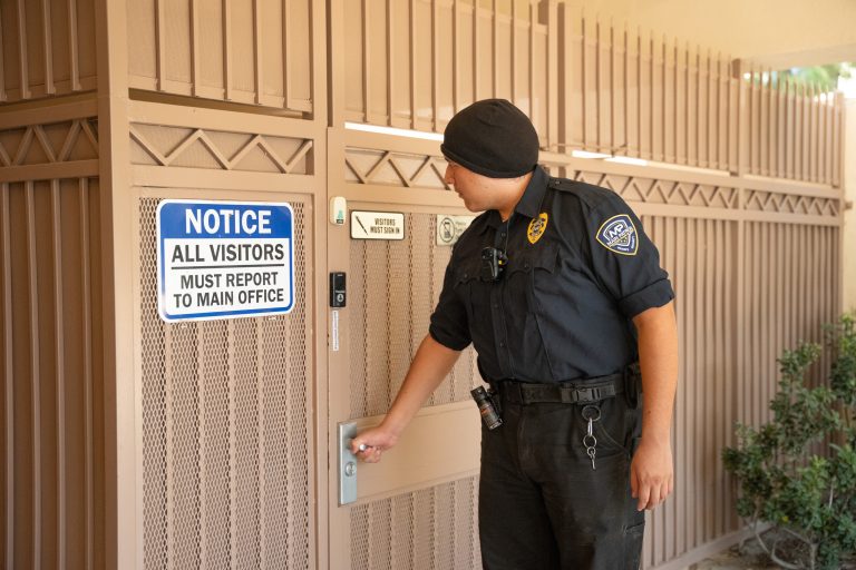 Main Patrol officer checking a secured access gate