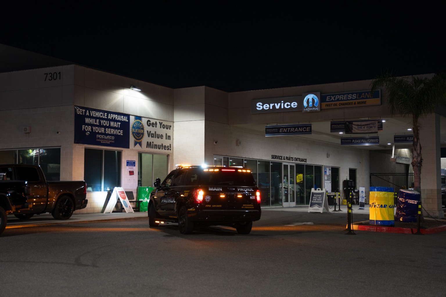 Main Patrol vehicle at a dealership service entrance at night