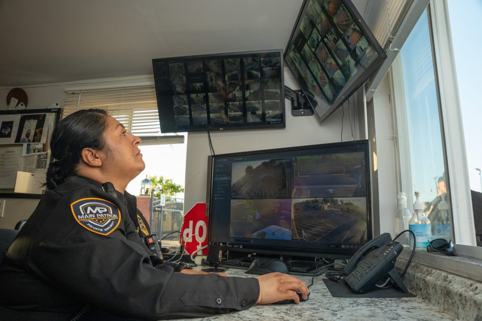 Main Patrol dispatcher monitoring cameras at the dispatch desk