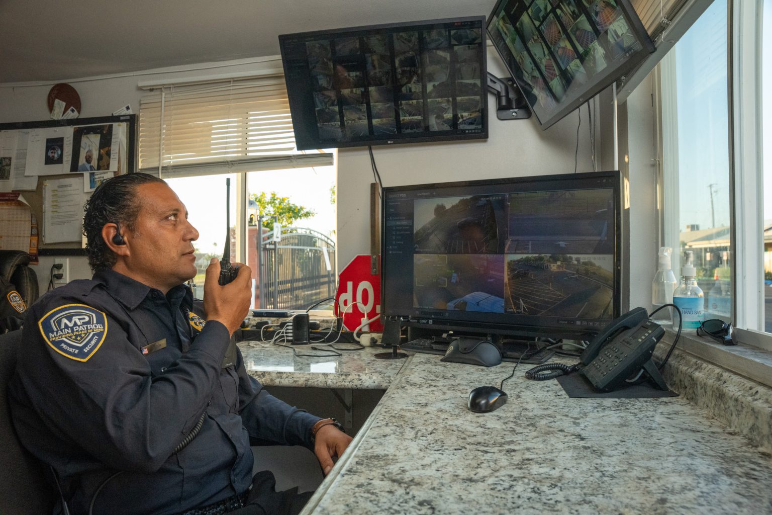 Main Patrol dispatcher on the radio at the security booth