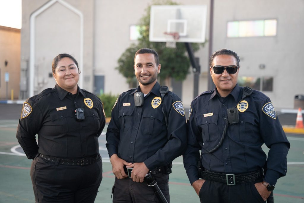 Three smiling Main Patrol security guards in uniform